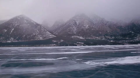 Frozen lake and mountains in a quick survey Stock Footage 49061897