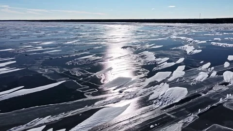 Frozen Lake Black Ice Surface Sun Reflection Latvia Winter Low Drone Shot Stock Footage 333318330