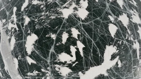 Frozen lake covered with a thick layer of ice, aerial shot Video stock 55191399