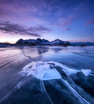 Frozen lake during sunset Stock Photos