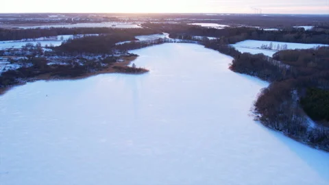 Frozen lake in the forest during the winter snow season. Stock Footage 169114324