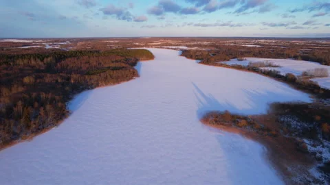 Frozen lake in the forest during the winter snow season. Stock Footage 169114764