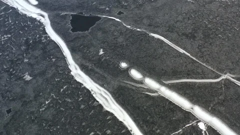 Frozen Lake High Up Drone View In Winter With Snow Trails 01 Stock Footage 125783188