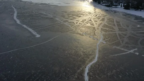 Frozen Lake High Up Drone View In Winter With Snow Trails 02 Stock Footage 125783274
