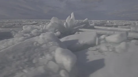 Frozen lake ice chunks Pan winter Drone Video stock 82974322