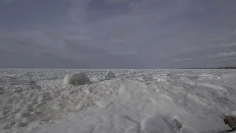 Frozen lake ice chunks winter Drone flyover Stock Footage 82974313