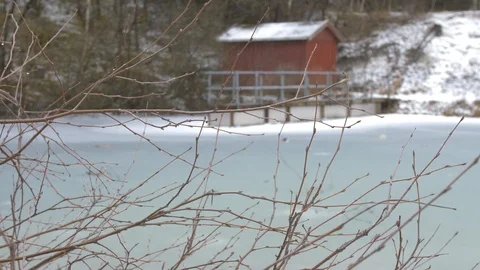 Frozen lake infront of a small red shed. Stock-Footage 87504896