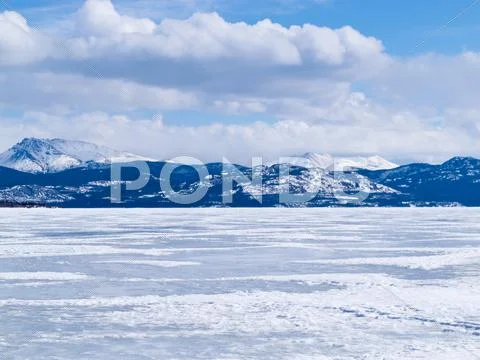 Frozen lake laberge winter landscape yukon canada Stock Photos
