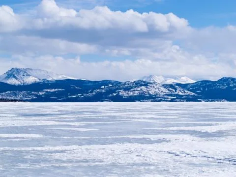 Frozen lake laberge winter landscape yukon canada Stock Photos
