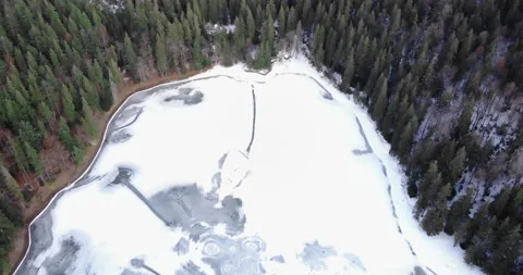Frozen lake in the middle of the forest from a height. Stock Footage 150503579
