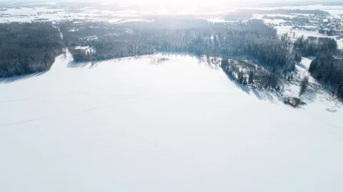 Frozen Lake Next to Forest, Aerial Pan View Stock Footage 86571337