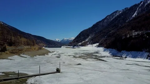 Frozen lake Pontechianale dam Piedmont aerial drone 4k Stock Footage