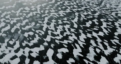 Frozen Lake with repeatable snow patterns from wide angle slowly Stock Footage 169104285