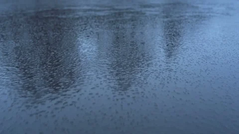 Frozen lake with a thin ice in the winter while it's raining Stock Footage 83241458