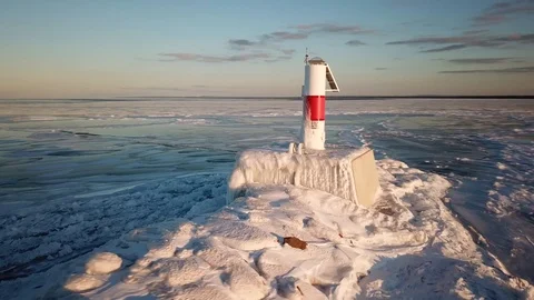 Frozen light house at sunset Stock Footage 100135495