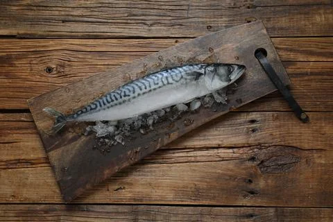 Frozen mackerel fish on wooden table, top view Stock Photos