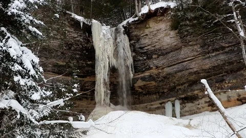 Frozen Majesty at Munising Falls – Winter Ice Formation Stock Footage 147954417