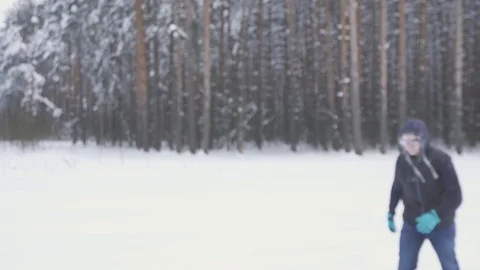A frozen man walks through the winter forest, after a snow storm, covered with Stock Footage 85578513