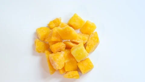 Frozen mango on a white background close-up top view. Stock Footage 164630275