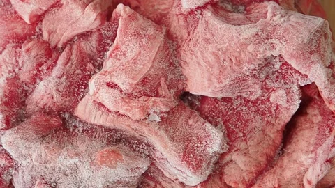 Frozen meat being prepared for cooking in the kitchen Stock Footage 342485231