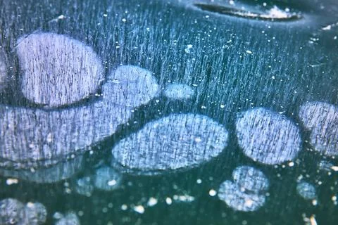 Frozen Methane Bubbles and Abstract Patterns in Winter Lake Ice Close Up Stock Photos