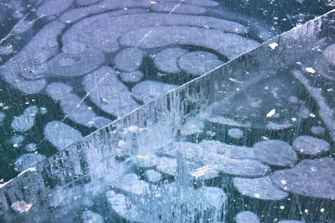 Frozen Methane Bubbles and Cracked Ice Texture Winter Abstract Close Up Stock Photos