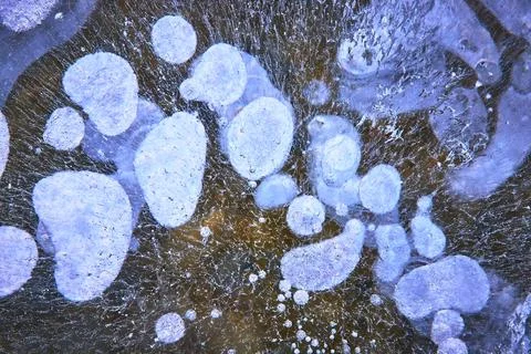 Frozen Methane Bubbles and Cracked Ice Texture Winter Abstract Nature Close U Stock Photos
