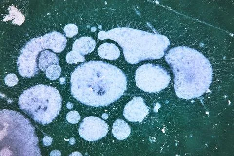 Frozen Methane Ice Bubbles Texture on Winter Lake Surface Close Up Stock Photos
