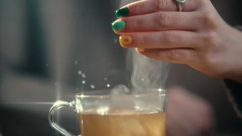 A Frozen Moment of sugar cube falling into tea Stock Footage 274985923