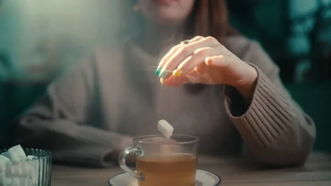 Frozen Moment of sugar cube falling into tea Stock Footage 274986121
