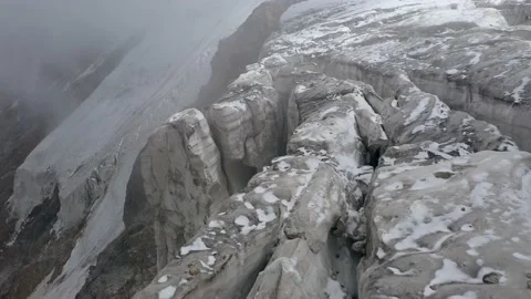 A frozen mountain glacier precipice. A torn ice texture of the glacial relief Stock Footage 169749950
