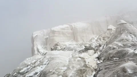 A frozen mountain glacier precipice. A torn ice texture of the glacial relief Stock Footage 169750054