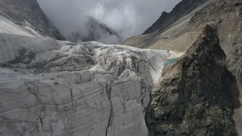 A frozen mountain glacier precipice. A torn icy pass, glacial relief. Majestic Stock Footage 169750222