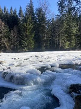 Frozen Mountain River with Ice Formations | Winter Landscape 写真素材