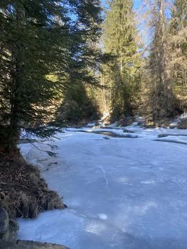 Frozen Mountain River with Ice Formations | Winter Landscape 写真素材