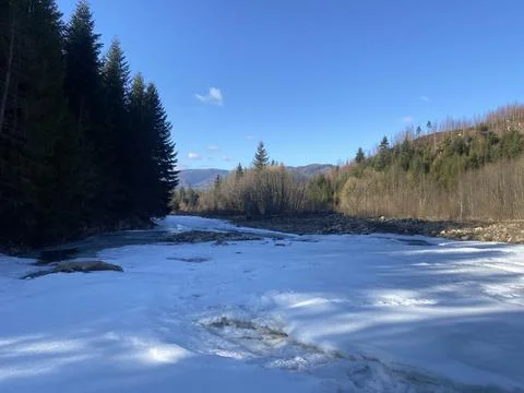Frozen Mountain River with Ice Formations | Winter Landscape 写真素材