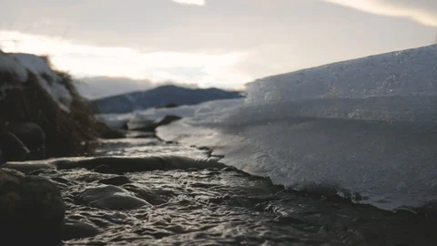 Frozen Mountain Stream sun light Stock Footage 102272668