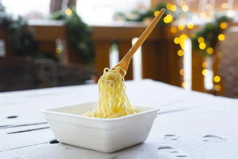 Frozen noodles on a fork on a very cold day in Siberia Stock Photos