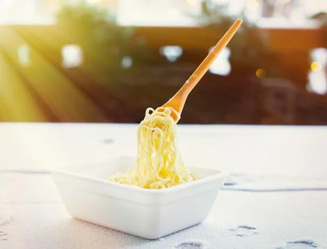 Frozen noodles on a fork on a very cold day in Siberia Stock Photos
