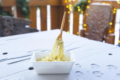 Frozen noodles on a fork on a very cold day in Siberia Stock Photos