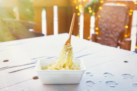 Frozen noodles on a fork on a very cold day in Siberia Stock Photos