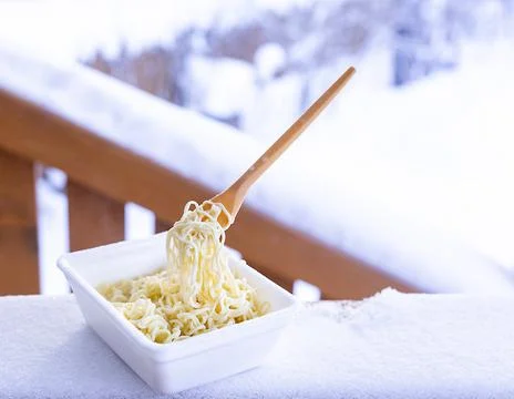 Frozen noodles on a fork on a very cold day in Siberia Stock Photos