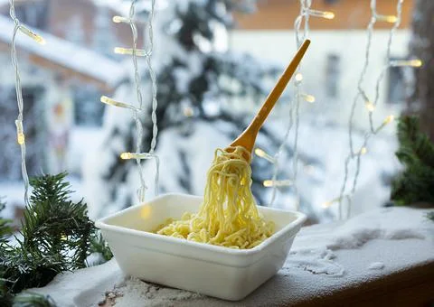 Frozen noodles on a fork on a very cold day in Siberia Stock Photos