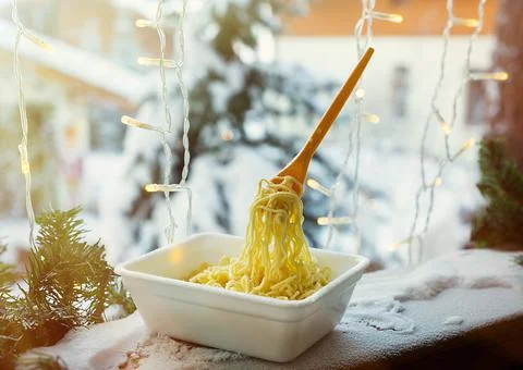 Frozen noodles on a fork on a very cold day in Siberia Stock Photos