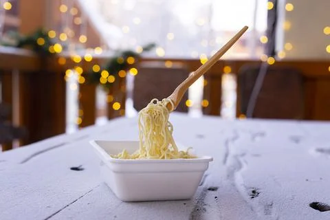 Frozen noodles on a fork on a very cold day in Siberia Stock Photos