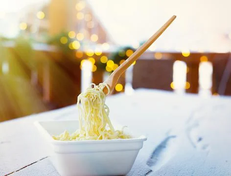 Frozen noodles on a fork on a very cold day in Siberia Stock Photos