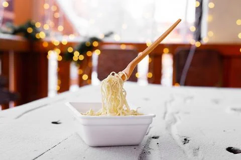 Frozen noodles on a fork on a very cold day in Siberia Stock Photos