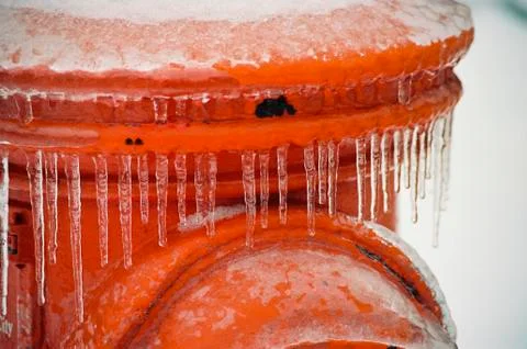 Frozen orange Fire Hydrant Stock Photos