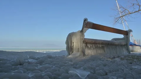 Frozen park bench covered with ice Video stock 326321775