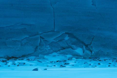 Frozen pattern on winter window. Blue ice winter background, texture blue Stock Photos